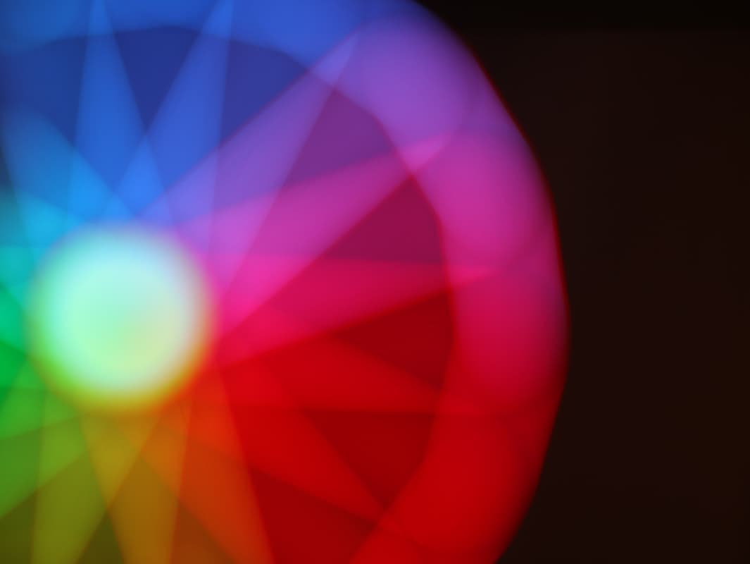A rainbow spectrurm wheel on a black background