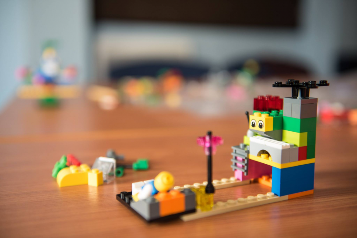 A colourful lego structure with a lego character