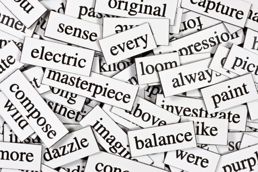 A pile of magnets with words on including 'masterpiece, always, balance, were, paint, every, original, sense, electric, dazzle'