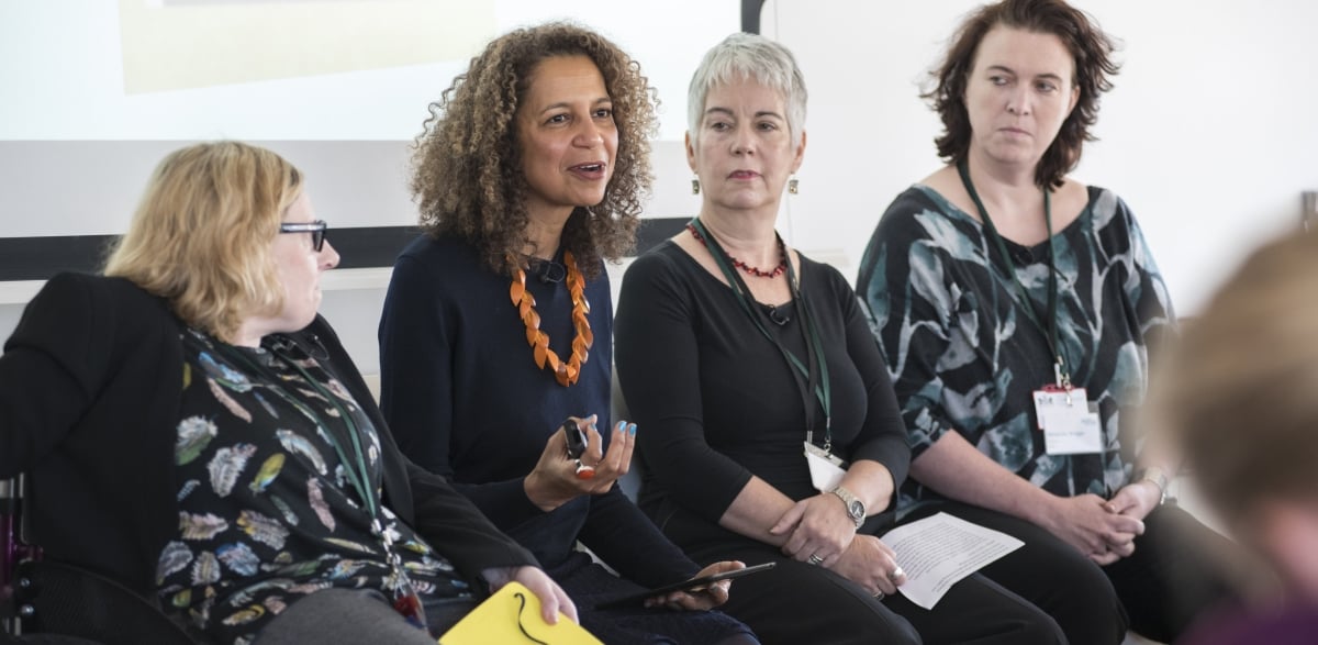 A group of four CGA members having a discussion