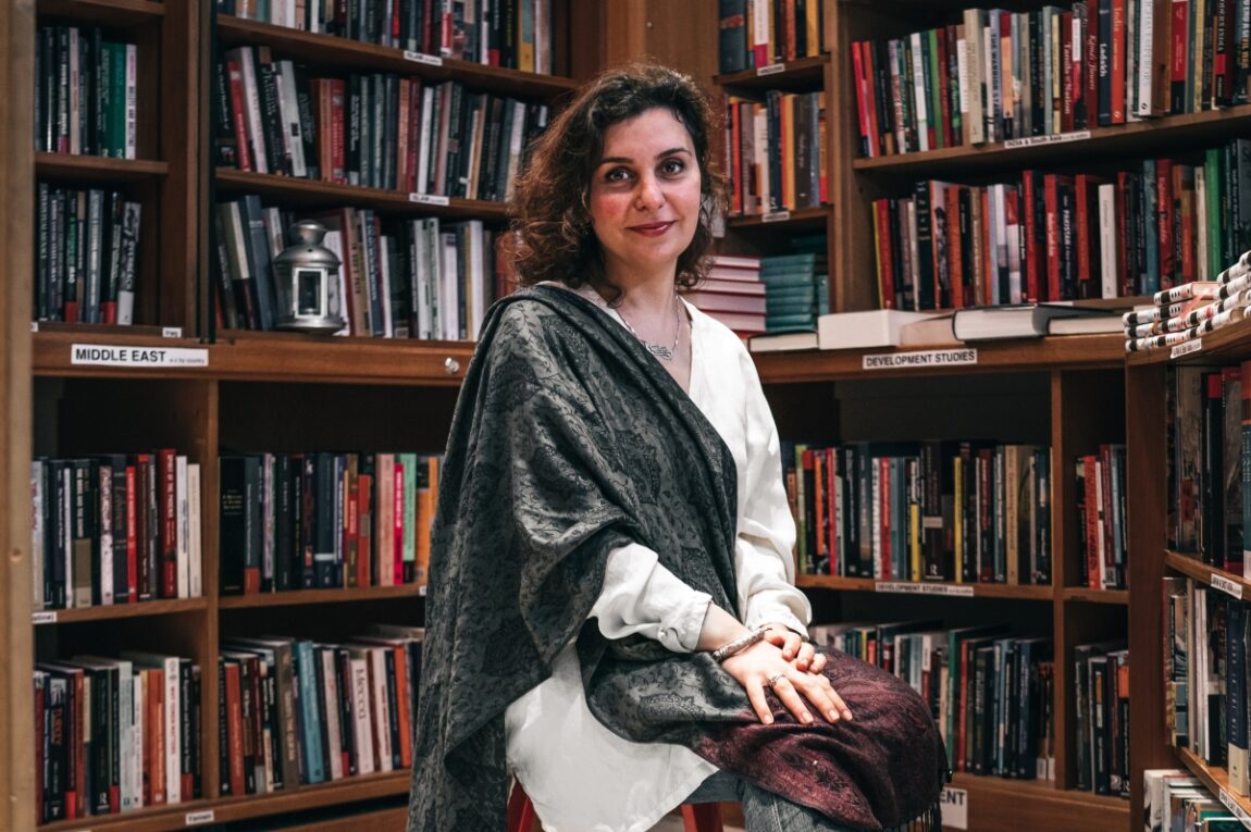 A portrait of a person in a library
