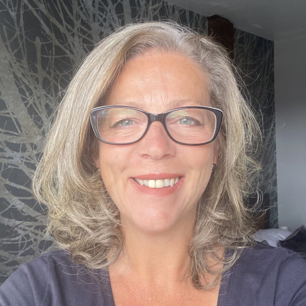 Headshot of Nicky Nuttal, she has blonde hair and is wearing glasses