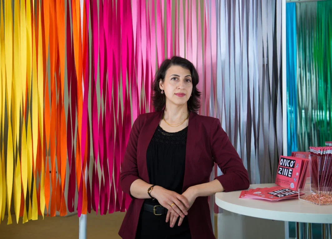 Headshot of Yasmin Khan against a multicoloured background